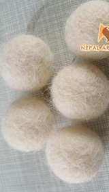 
wool felt balls, felt wool rugs, needle felting, pom poms, nepal, wholesale, felt pom, diy felt, nepal, fair trade, felted wool, round rugs, pom pom